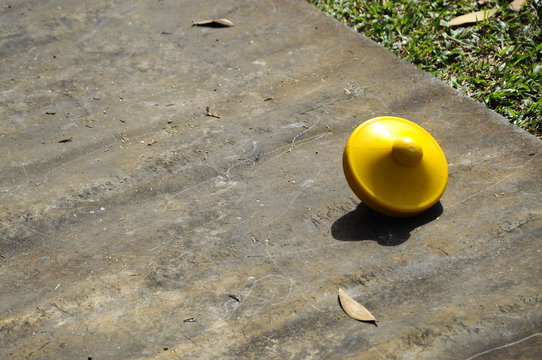 Gasing Or Tops Spinning. The Traditional Games Popular Among Malaysian Malay. Especially Among The Villagers In The State Of Kelantan And Melaka.  