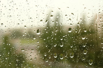 Raindrops on the windowpane. Rain drops on the glass. Close-up. Background. Texture.