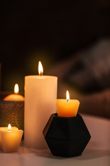 Obraz na płótnie Canvas Burning candles on table indoors