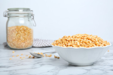 Ceramic bowl with dried peas on table