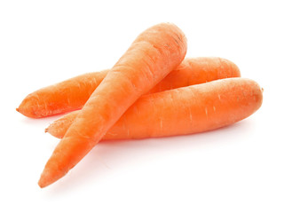 Ripe fresh carrots on white background