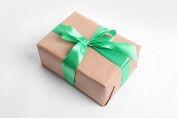 Beautifully wrapped gift box on white background