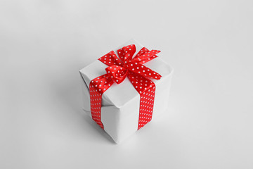 Beautifully wrapped gift box on white background