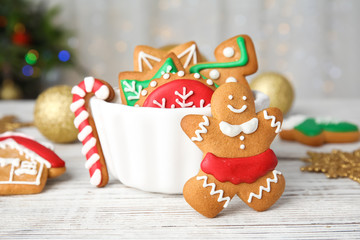Bowl with tasty homemade Christmas cookies on table