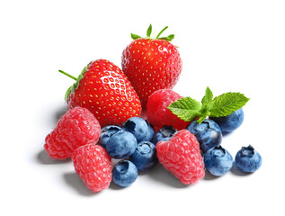 Fototapeta na wymiar Raspberries, strawberries and blueberries on white background