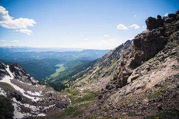 Landscape view overlooking Piney Lake and the Rocky Mountains from the summit of the Gore Range, 