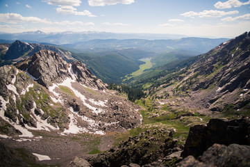 Landscape view overlooking Piney Lake and the Rocky Mountains from the summit of the Gore Range, 