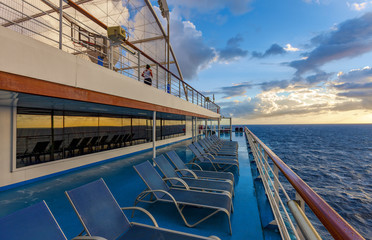 Deck of the passenger liner lit by the sunrise