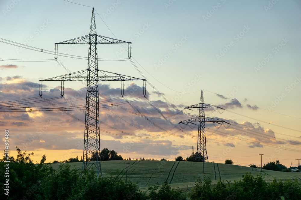 Wall mural high voltage power line in front of dramatic sky