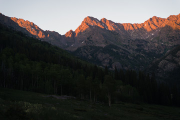Sunset view of the Gore Range in Colorado near Piney Lake during summer. 