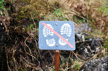 the prohibition sign with footprints, you can not step.
