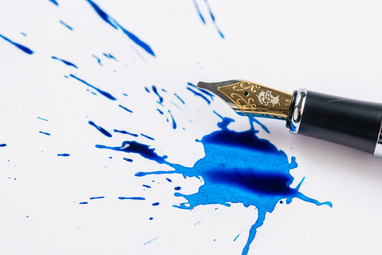 Fountain pen and fountain pen ink making a spatter on white paper