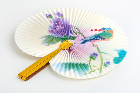 Closeup of Traditional Chinese paper fan on white background.Hand paper fan