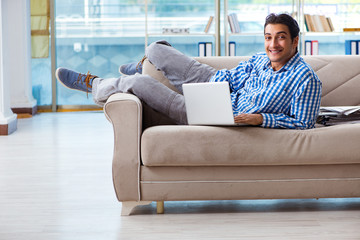 Caucasian student with laptop preparing for university exams