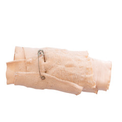 Safety pin on old elastic bandage on white background