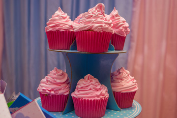  several pink cupcakes ready to be eaten
