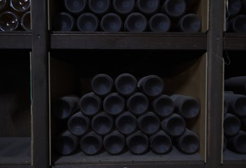 Yamanashi,Japan-June 30, 2018: Very old rare wine bottles stored quietly in a wine cellar