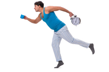 Man waking up with alarm clock isolated on white
