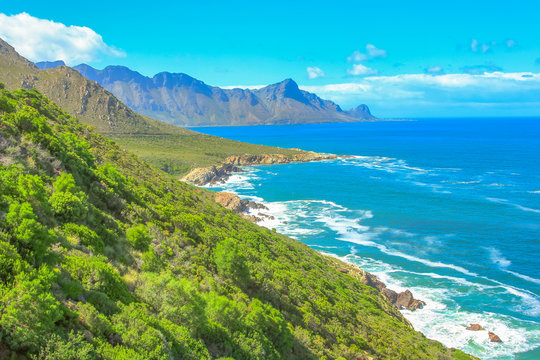 Scenic coastal R44 on eastern part of False Bay near Kogel Bay Beach between Gordon's Bay and Pringle Bay in Western Cape, South Africa. Beautiful mountain scenery along Route 44 in summer season.
