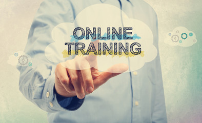 Online Training with businessman on a soft colored wall 