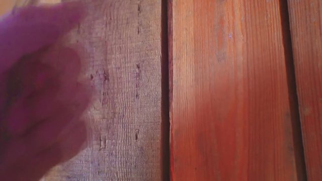 male fist aggressively knocks on a wooden door.Close-up.