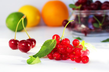 Still life of fresh berries and fruits. Vitamin supplement. Dessert for gourmets. Dietary and vegetarian dishes. Add to your diet. Side view, selective focus.