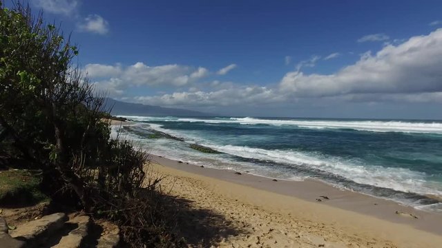 Hookipa Beach Maui Hawaii – 4k video of Hookipa Beach on a windy day in Maui Hawaii with crashing waves.  Beautiful high-resolution video of the Hawaiian Islands and beautiful water.