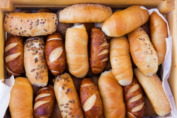 mix of breads in a wooden basket