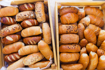 mix of breads in a wooden basket