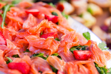 thin slices of freshsalmon fillet on a plate