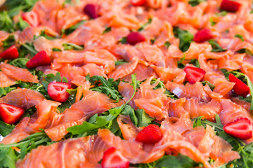 thin slices of freshsalmon fillet on a plate