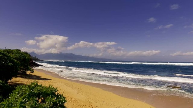 Hookipa Beach Maui Hawaii &ndash; 4k video of Hookipa Beach on a windy day in Maui Hawaii with crashing waves.  Beautiful high-resolution video of the Hawaiian Islands and water.