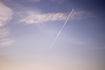 trace of the plane on the background of blue sky