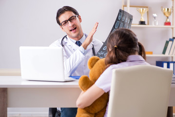 Little girl visiting doctor for regular check-up