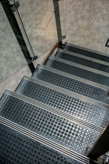 Non-slip stairs with dot pattern close up for background.