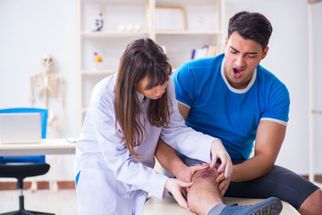 Fototapeta premium Patient visiting doctor after sustaining sports injury