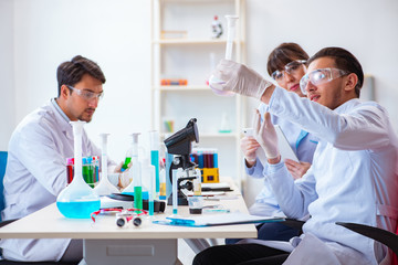 Team of chemists working in the lab
