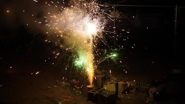A slow motion view of low level home fireworks.  	