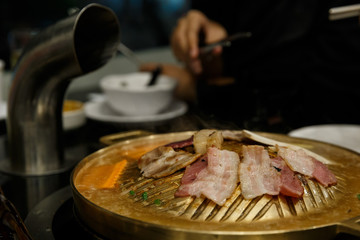 Pork grill on BBQ brass pan.