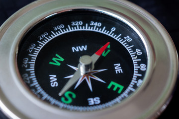 Macro focus compass on black background