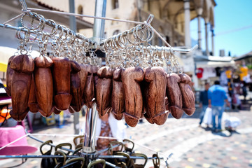 Phalic wooden keyring souvenirs being sold in one of Athens street vendors
