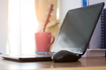 The desk with laptop ready for working.