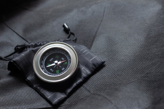 Compass on black fabric