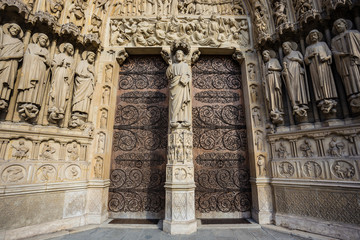 Wide angle photo of entrace gates of the Notre Dame Cathedral in Paris, France.