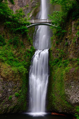 Bridge over waterfalls Multnomah Falls in summer. Beautiful waterfalls near Portland. Second highest year-round waterfall in the US. Oregon. United States of America.