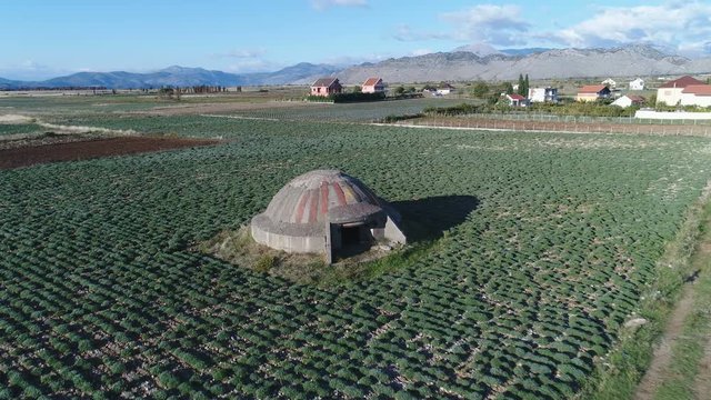 Flying past crumbling bunker, a common sight across Albania where more than 170,000 bunkers were constructed during the Hoxha regime