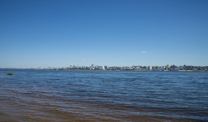 View of the city from the opposite Bank of the Volga river in Samara, Russia. On a Sunny summer day. 28 June 2018