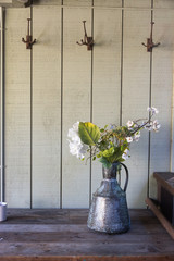 flowers in rustic pitcher