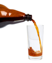 Dark brown plastic bottle of beer or kvass with glass cup isolated on a white background.