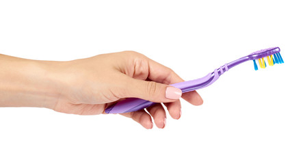 Color new toothbrush with hand isolated on a white background.